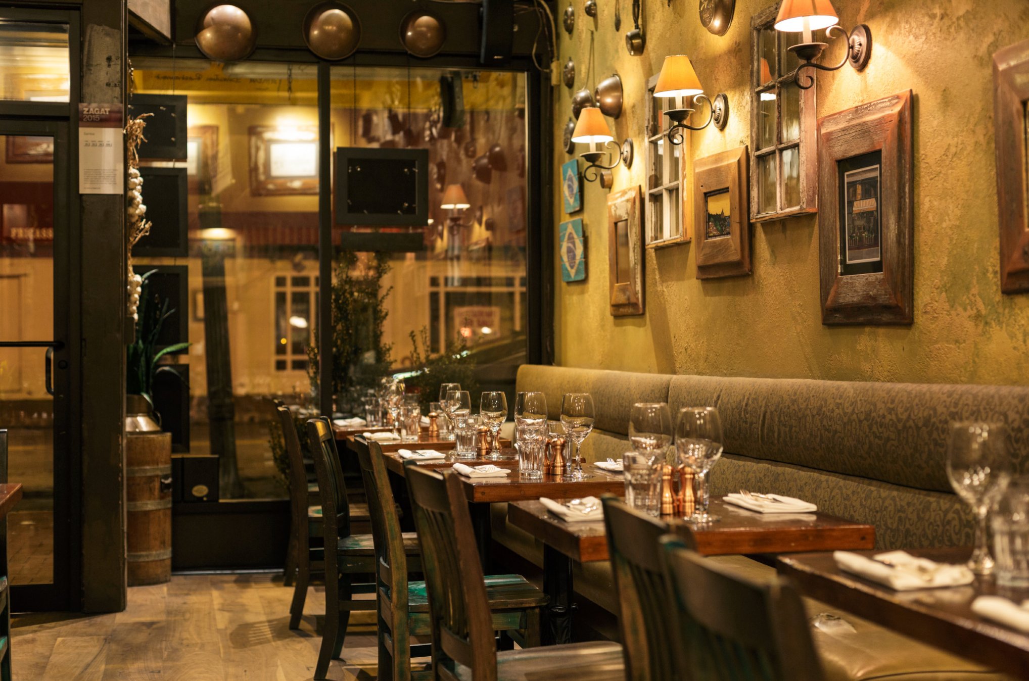 Samba dining room — copper pots, banquette, candlelight