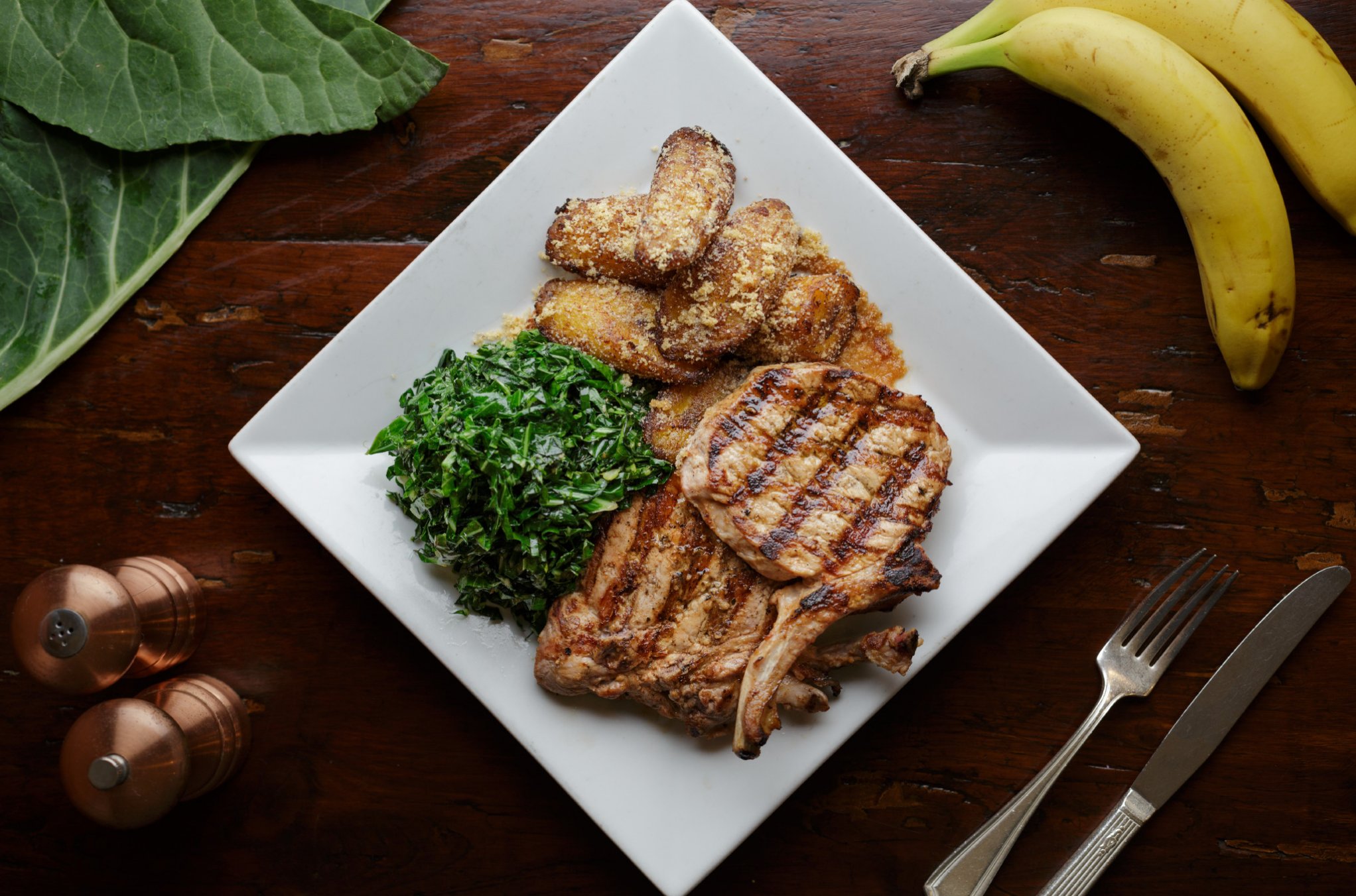 Pork chop with collards and plantains