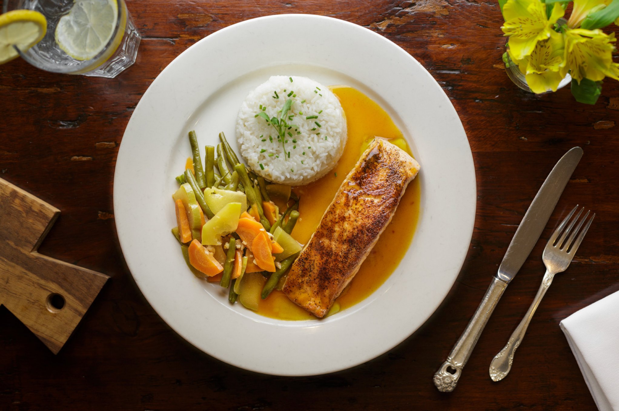 Plated salmon with rice and vegetables